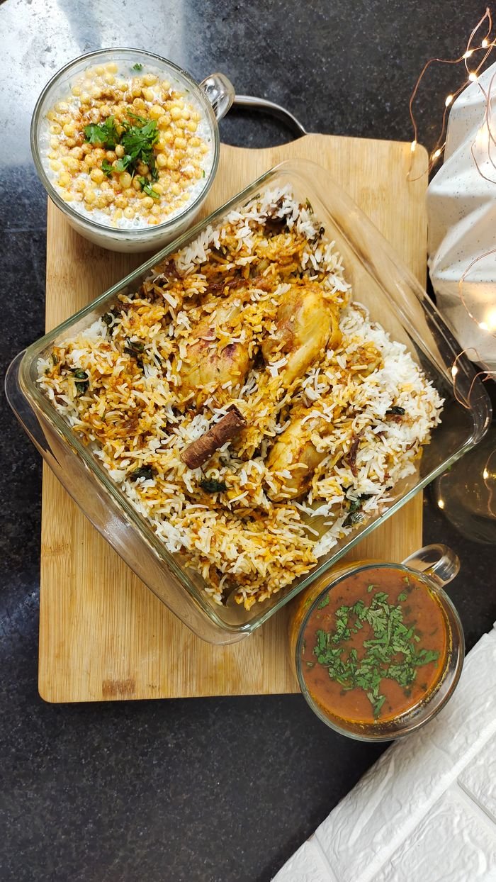 Mastering the First Impression: Your intriguing post title goes here Mouthwatering Indian biryani served with flavorful sides on a rustic wooden board.